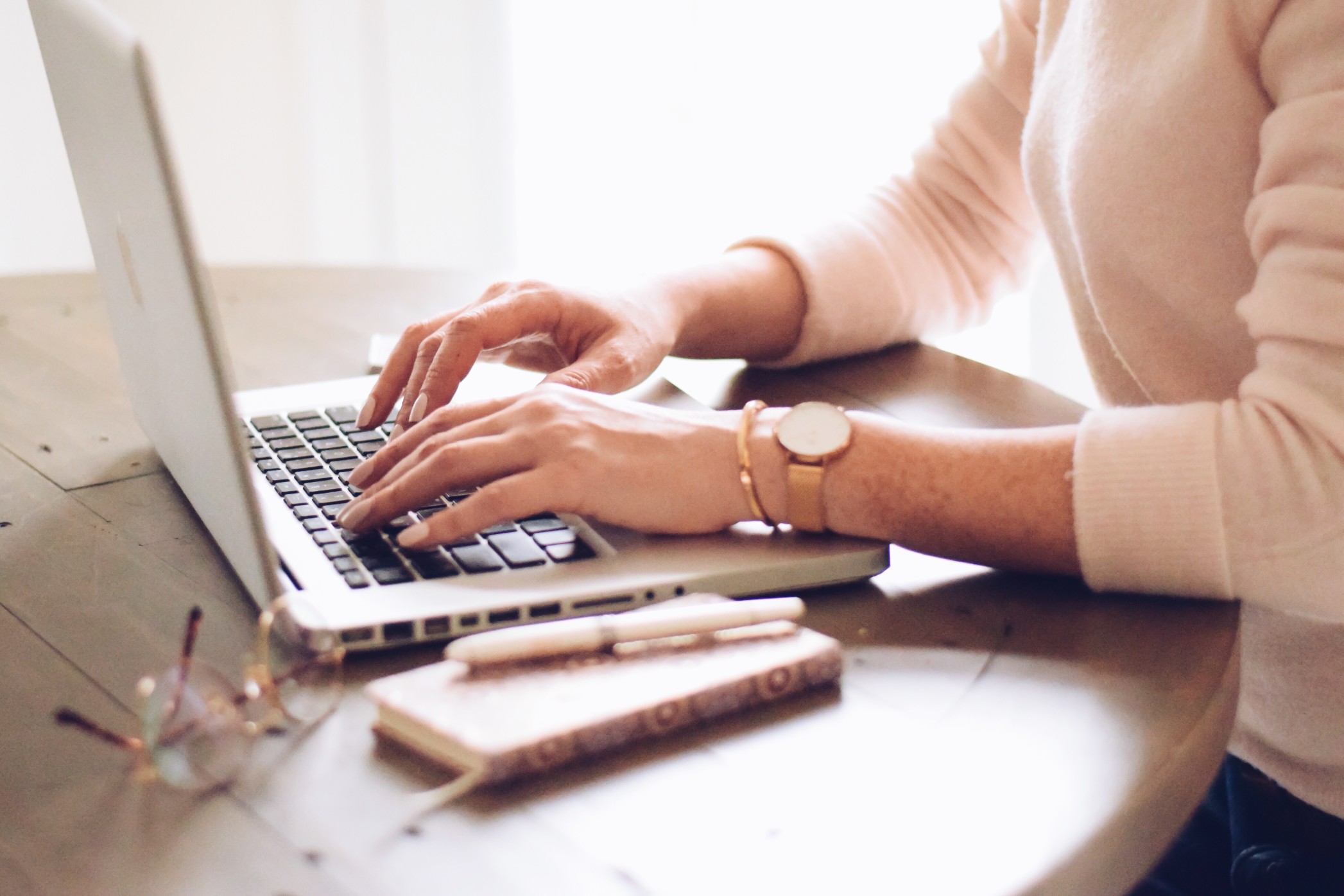 woman-is-typing-on-a-laptop-computer-sitting-at-a-desk-working-from-home_t20_no2j0n