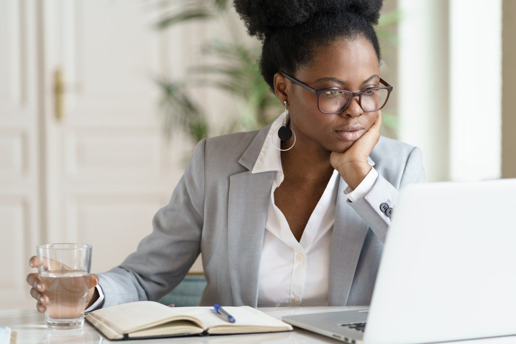 focused-young-african-american-businesswoman-or-student-in-blazer-wear-glasses-working-at-laptop-at_t20_omOEXk